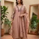 Dusty rose Mul Chanderi suit with dark floral detailing at the neckline and sleeves, matching trousers and dupatta