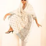 Ivory cotton suit set with black motif print and floral striped panels — Front view