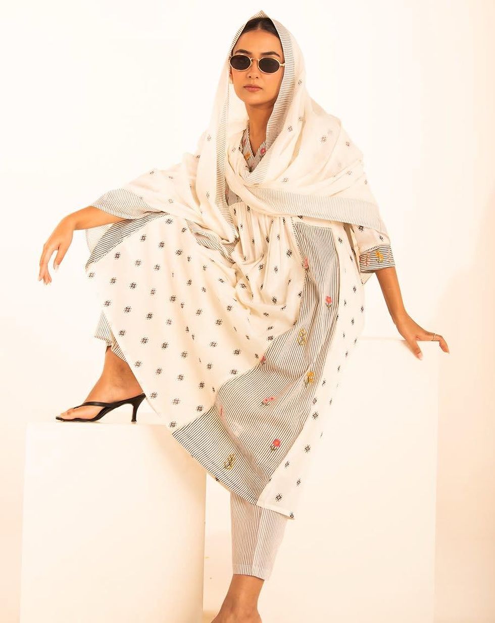 Ivory cotton suit set with black motif print and floral striped panels — Front view