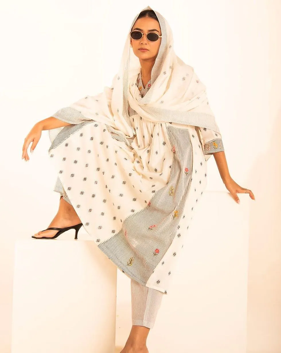 Ivory cotton suit set with black motif print and floral striped panels — Front view
