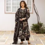 Black floral Mul Chanderi suit with mirror detail yoke, tassels, black trousers and matching floral dupatta