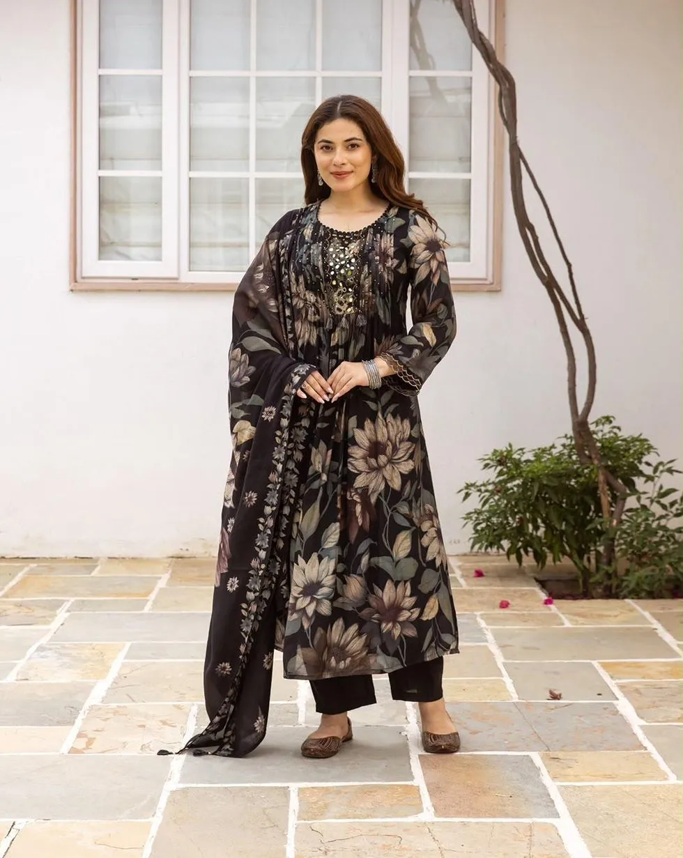 Black floral Mul Chanderi suit with mirror detail yoke, tassels, black trousers and matching floral dupatta