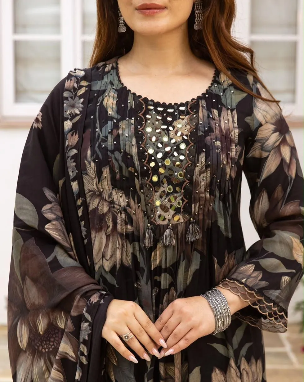 Black floral Mul Chanderi suit with mirror detail yoke, tassels, black trousers and matching floral dupatta