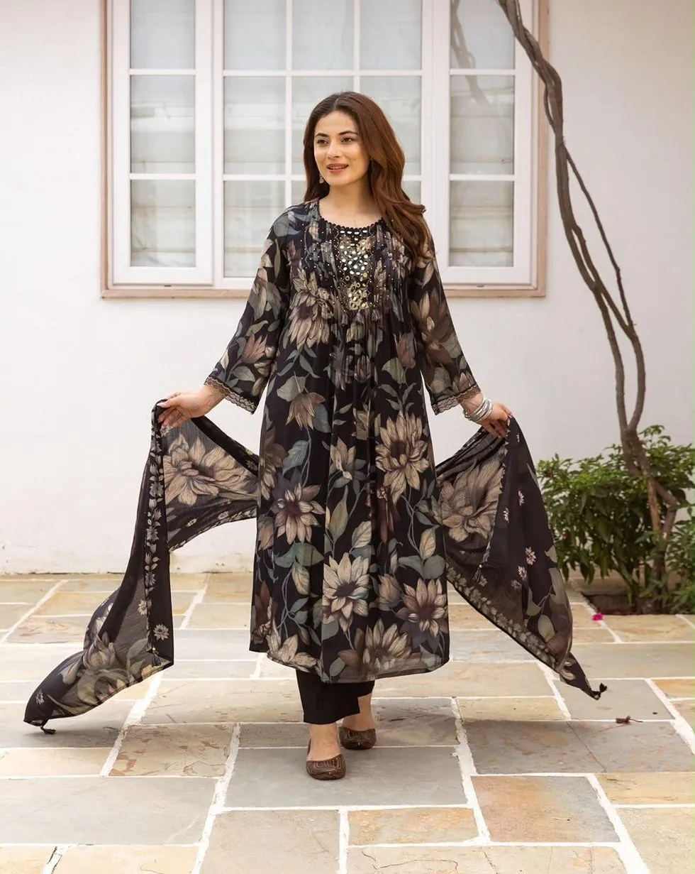 Black floral Mul Chanderi suit with mirror detail yoke, tassels, black trousers and matching floral dupatta