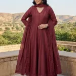 Burgundy Mul Chanderi Anarkali suit with tonal lace panels, matching trousers and lace-trimmed dupatta