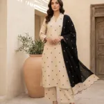 Ivory cotton kurta and trousers with small black motifs and a black dupatta with scalloped ivory border - view 2