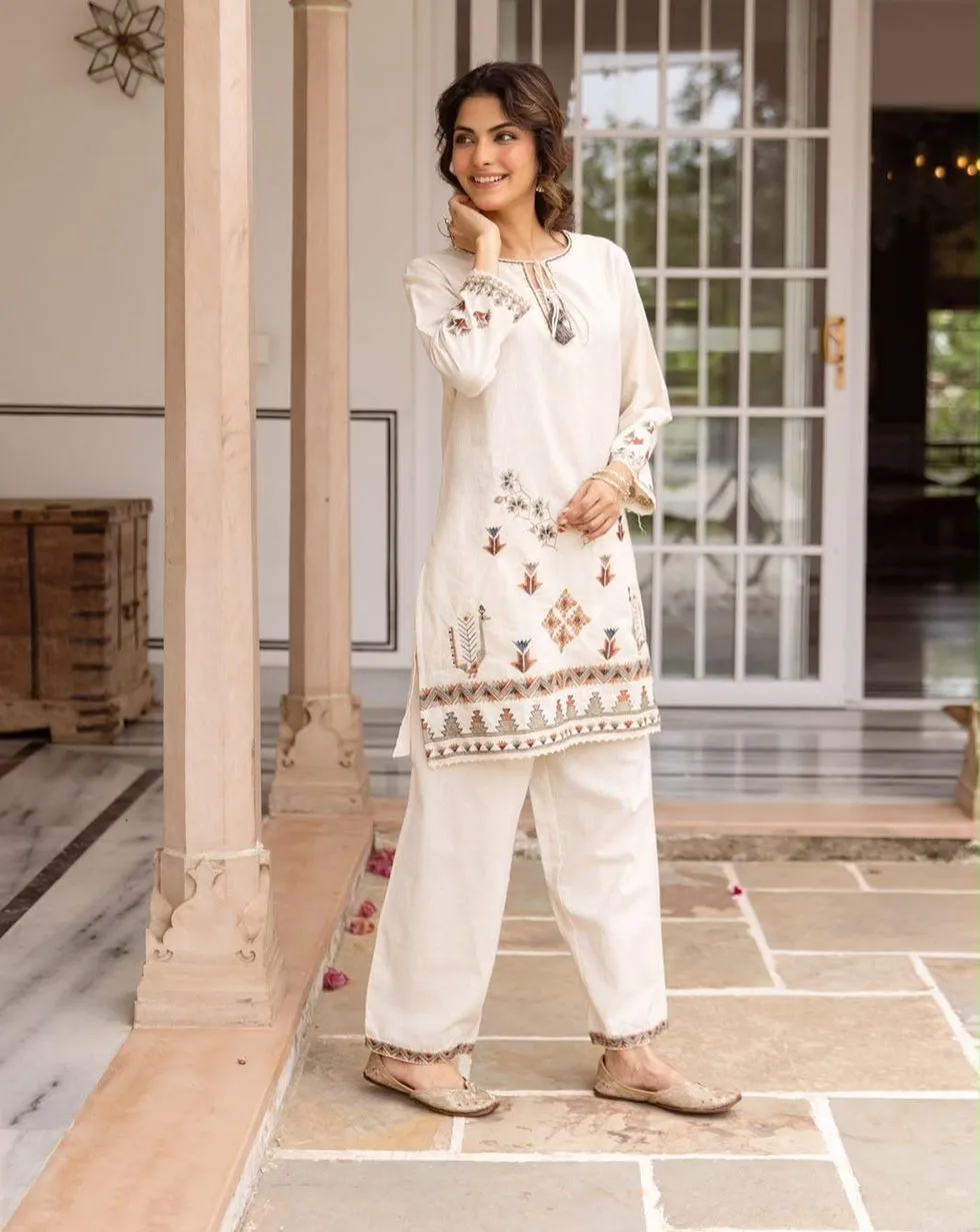 Ivory cotton co-ord set with floral and geometric embroidery, tassel neckline and matching trousers