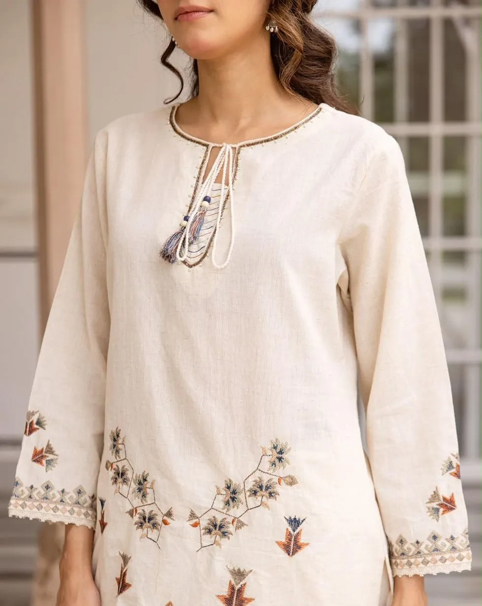 Ivory cotton co-ord set with floral and geometric embroidery, tassel neckline and matching trousers