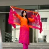Orange and fuchsia Mul Silk suit set with floral detailing, fuchsia trousers and coordinating sheer dupatta