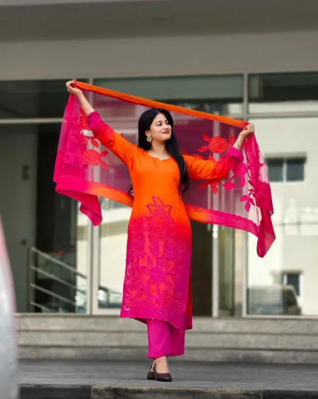 Orange and fuchsia Mul Silk suit set with floral detailing, fuchsia trousers and coordinating sheer dupatta