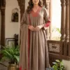 Taupe Mul Chanderi A-line suit set with red embroidered neckline and sleeves, matching trousers and dupatta